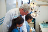 Dr. Joseph McManus and Staff in dental van